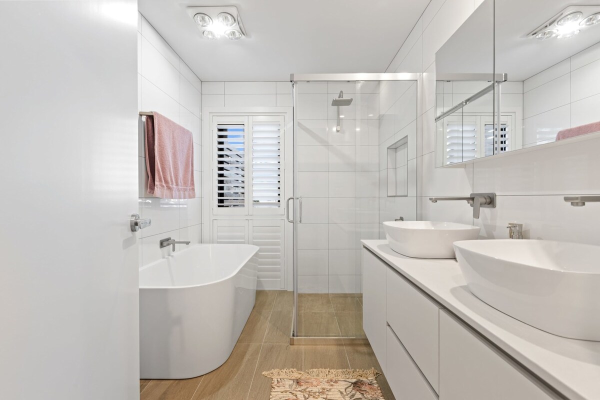 Upstairs bathroom with a luxurious bathtub