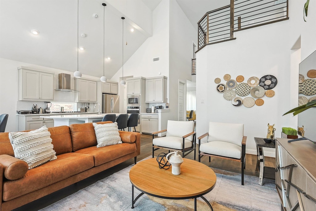 Offering the best of elegance, luxury, and cozy comfort, this living room has it all – high ceilings, a fireplace, tasteful furniture, and designer décor!