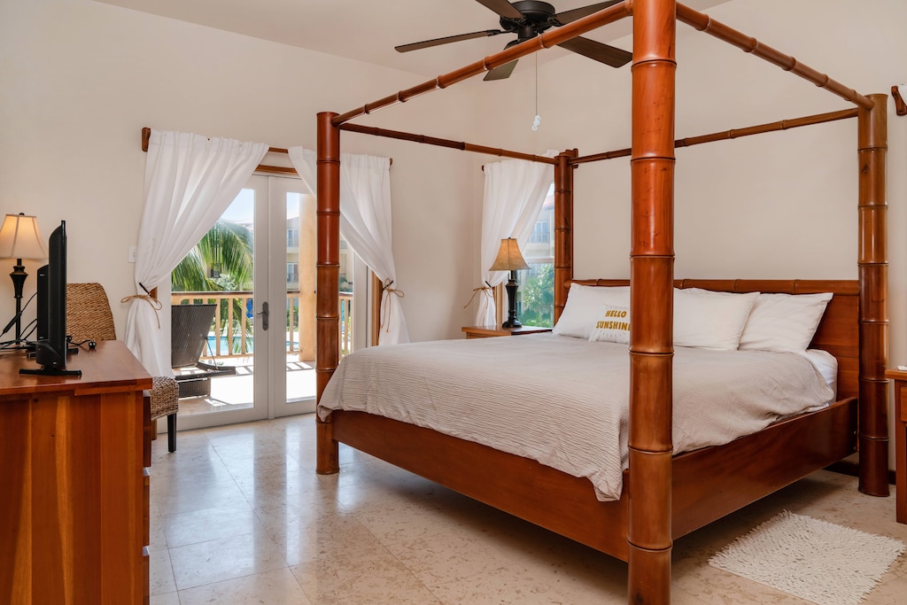 King Master Bedroom with doors out to patio