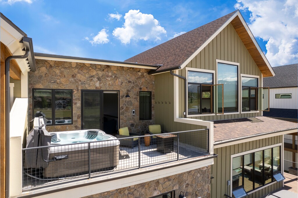 Patio off of Upstairs living area with Private Hot tub and Gas Fireplace