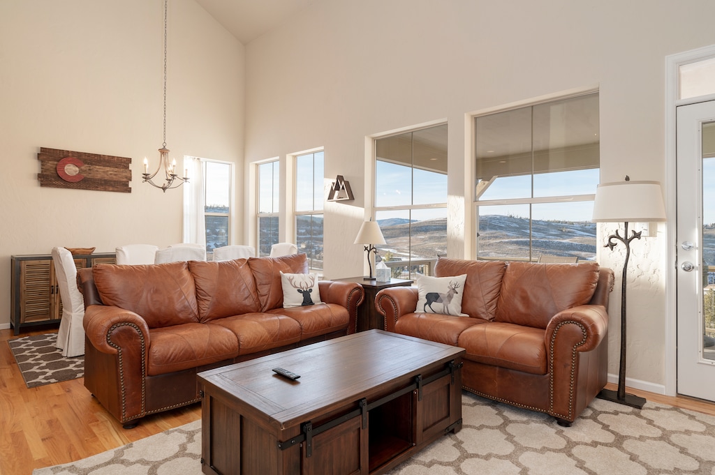 - Open concept living with leather sofas and natural light   - Bright windows showcase stunning Winter Park mountain views   - Comfortable gathering space with rustic mountain style