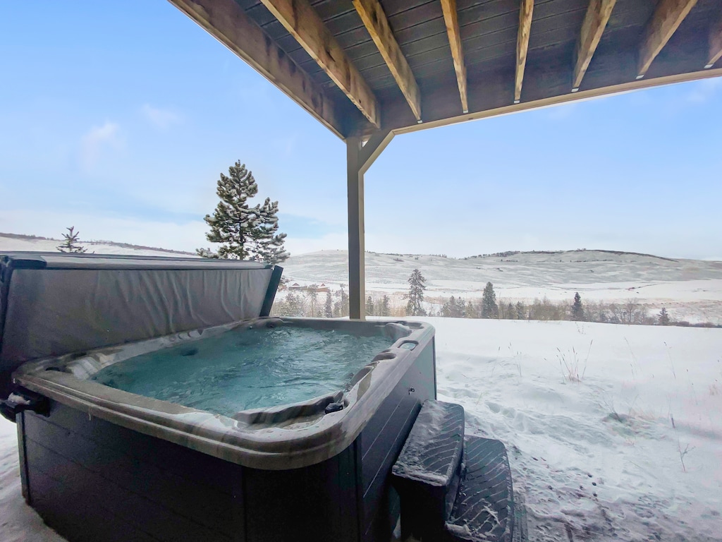 - Private hot tub with snowy mountain scenery around   - Relaxing soak spot after skiing or outdoor activities   - Covered patio makes it usable in every season stay