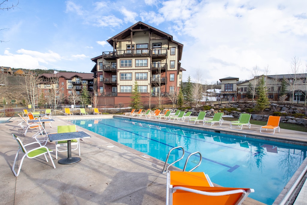 - Heated outdoor pool with lounge chairs and mountain views   - Perfect for family fun or unwinding under sunny skies   - Resort style amenity adds to Winter Park vacation charm