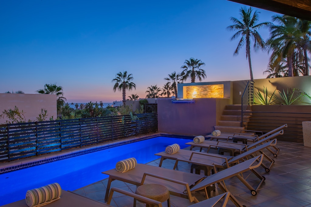 Poolside patio with gorgeous ocean views during sunset