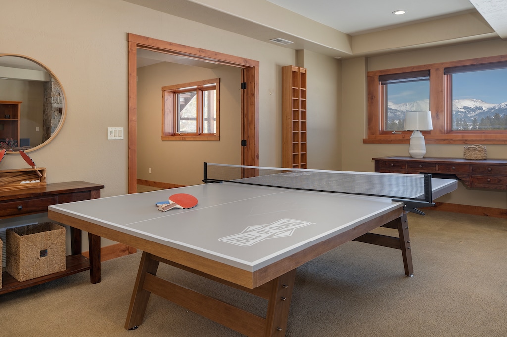 - Unwind with a friendly match in this bright and fun ping pong room - Soft carpet and natural wood trim offer comfort and classic style - Large windows bring in daylight and glimpses of surrounding scenery