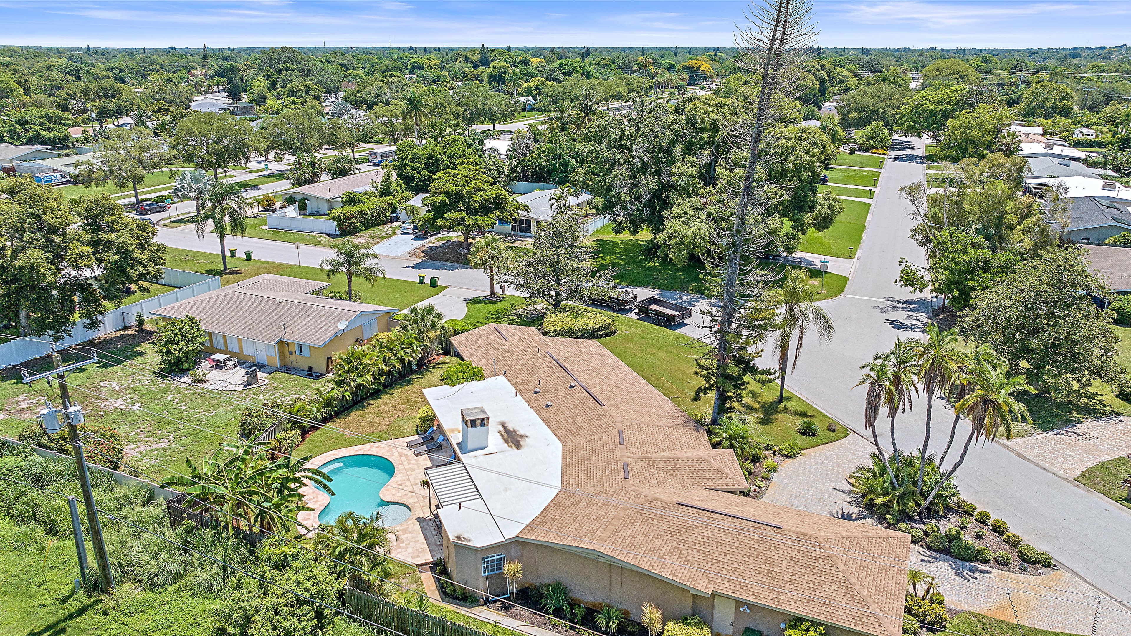 Aerial view of the home, pool and surrounding homes.