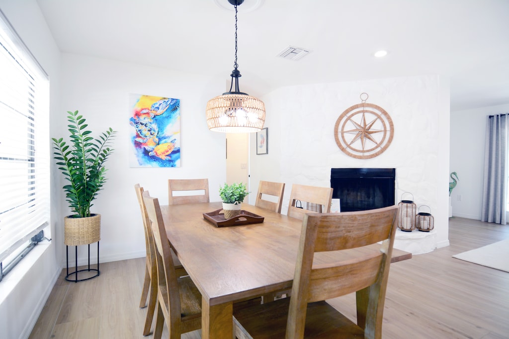 Large dining room table overlooking the fireplace with seating for 6 (2 extra chairs available in closet). Great for family meals and gatherings.