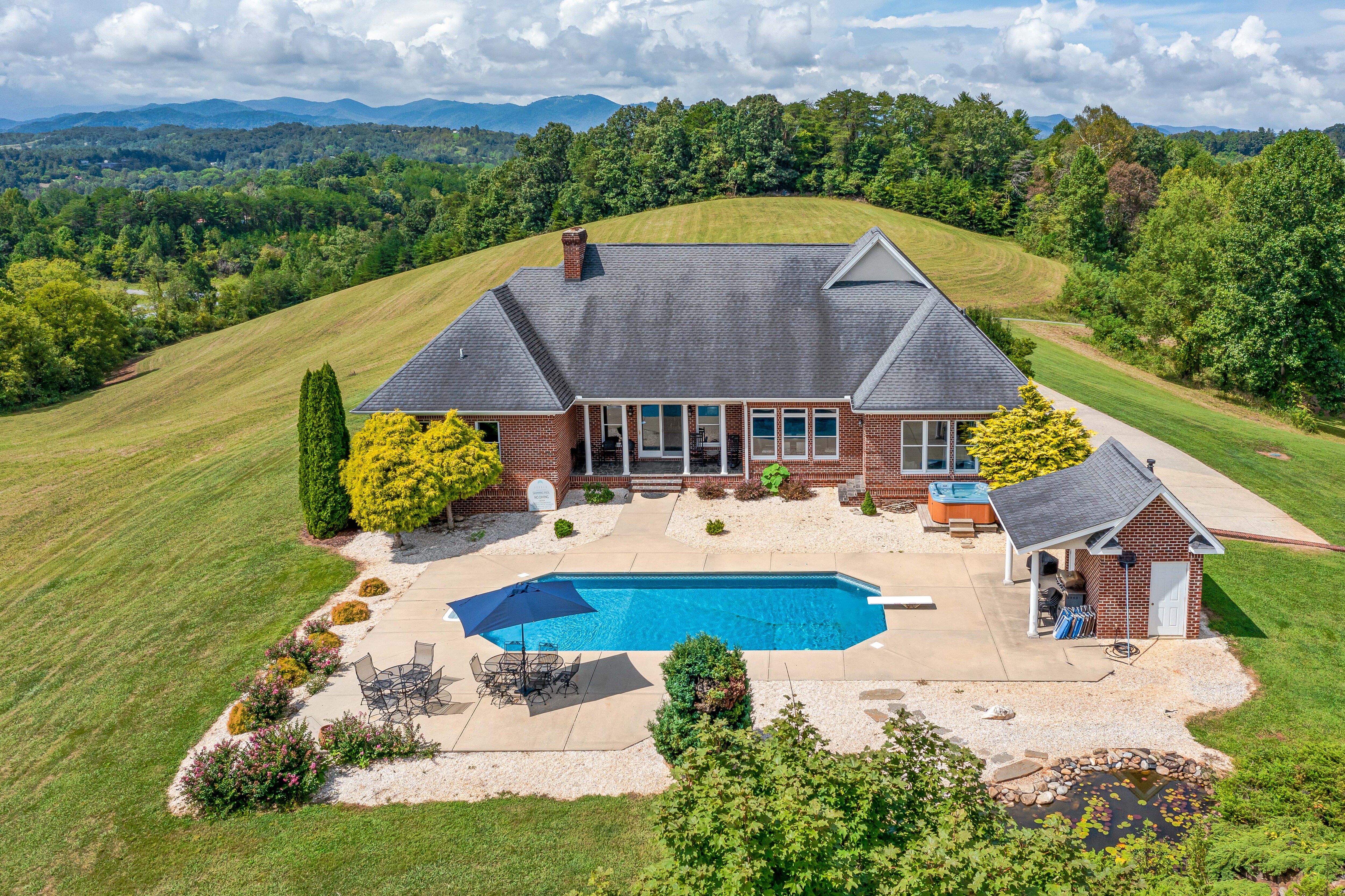 Get ready to be “wowed” by this 4,500+ sq. ft. spectacular modern, brick, Colonial-style retreat estate with soaring vistas.