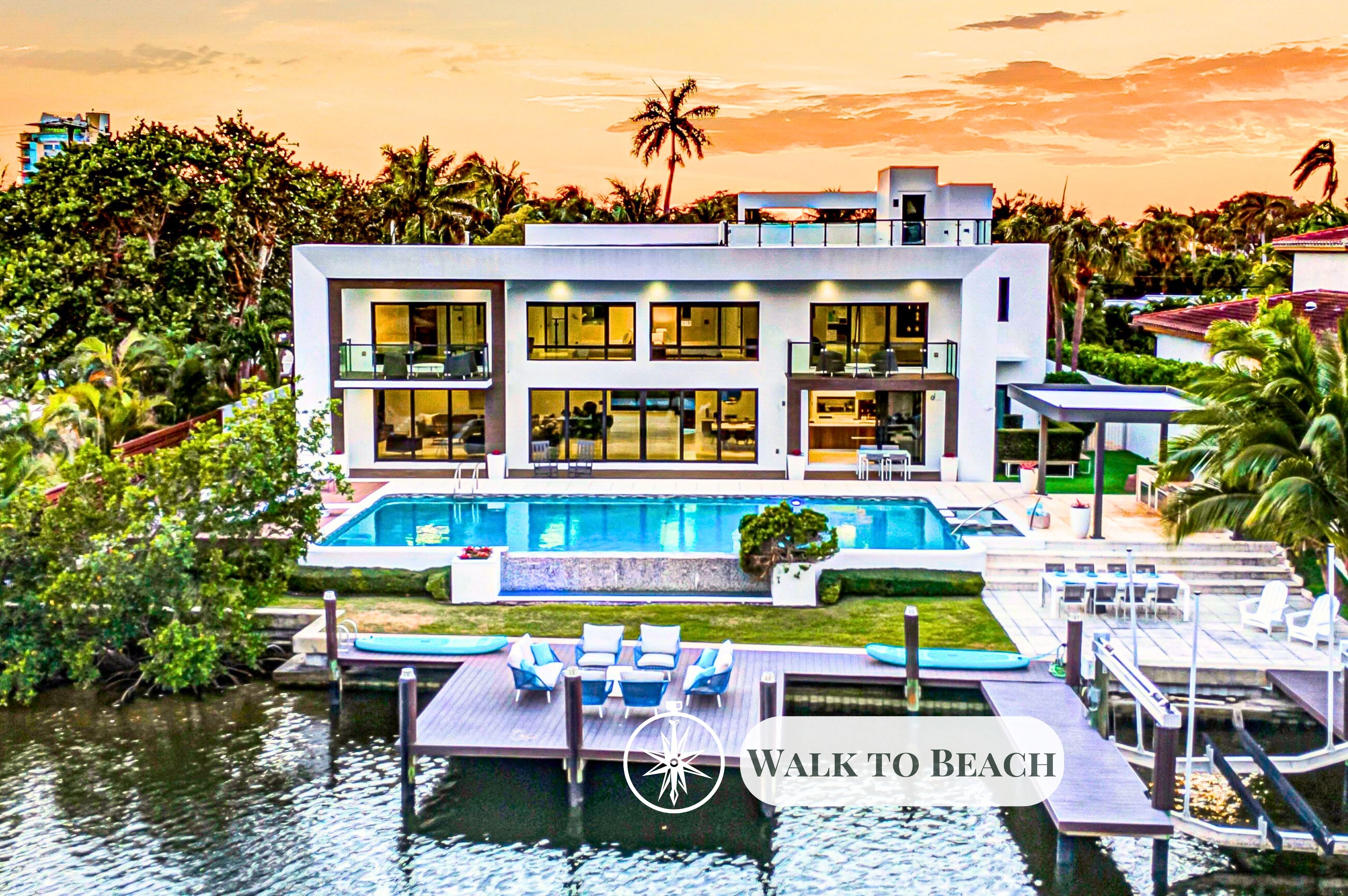 This exquisite waterfront modern villa embodies the quintessence o tranquility and serenity just a short 10 min walk to Bahia Mar beach and steps from restaurants.
