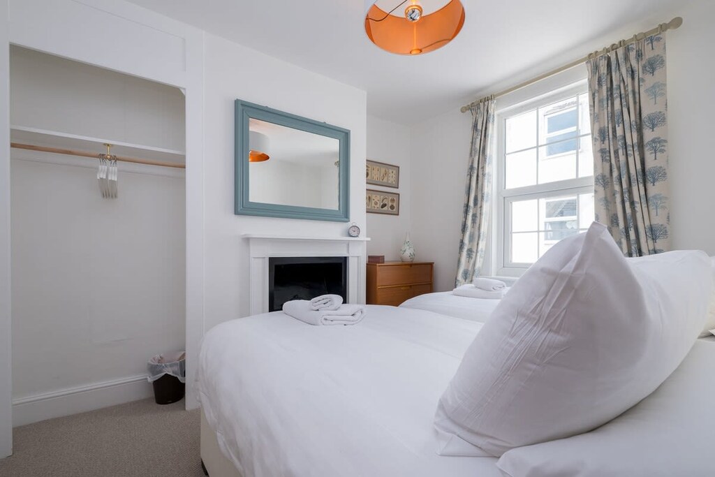 This bedroom has 2 single beds with plenty of fresh linen plus space to store your personal items.