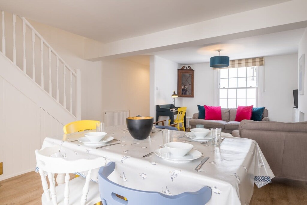 Dining room is open plan onto the living space, which also has a desk.