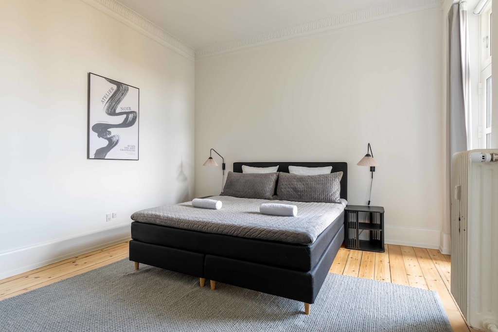 Indulge in comfort and tranquility in our inviting bedroom sanctuary. Sink into the luxurious queen-sized bed, adorned with soft linens and plush pillows, promising a restful night's sleep