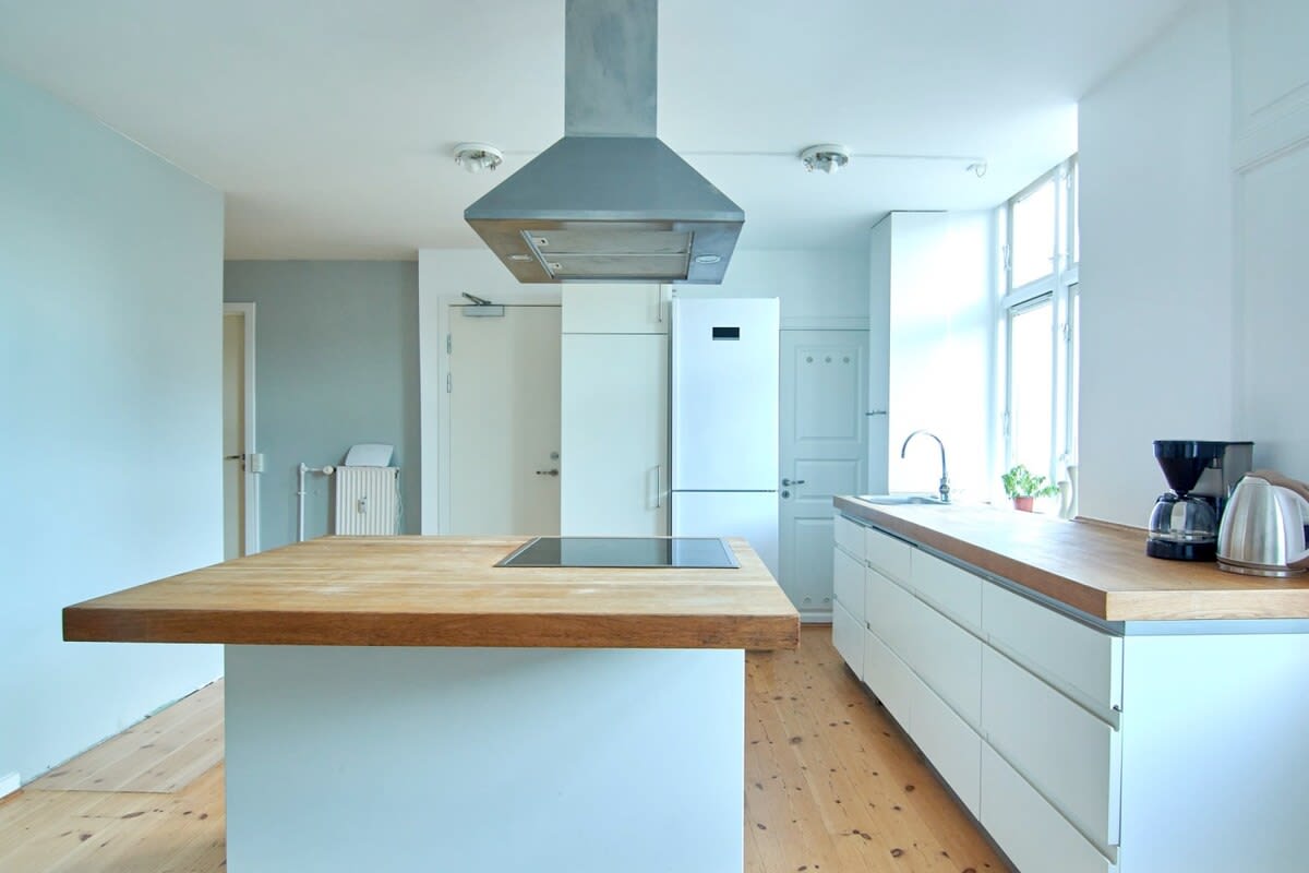 The ample counter space and storage on the kitchen island make it easy to keep everything organized and within reach.