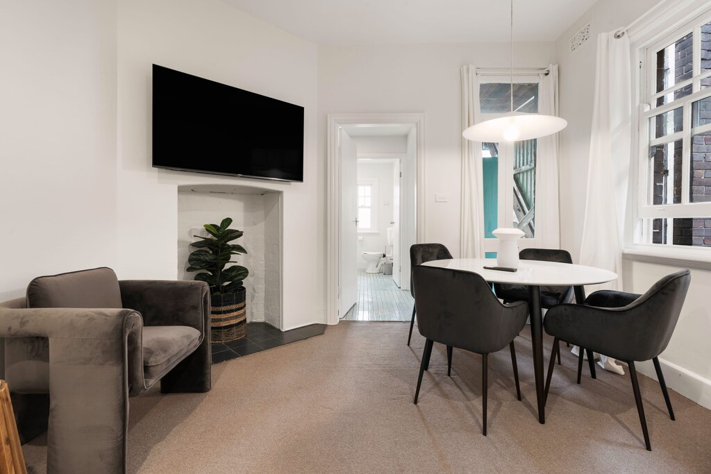 The meticulously designed living room optimizes space and aesthetics.