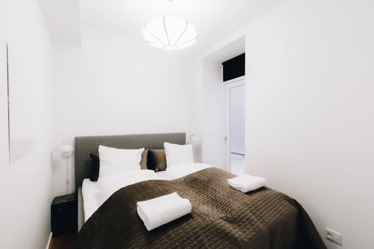 The apartment has a cozy and inviting bedroom, complete with a comfortable double bed and blackout curtains to ensure a peaceful night's sleep.