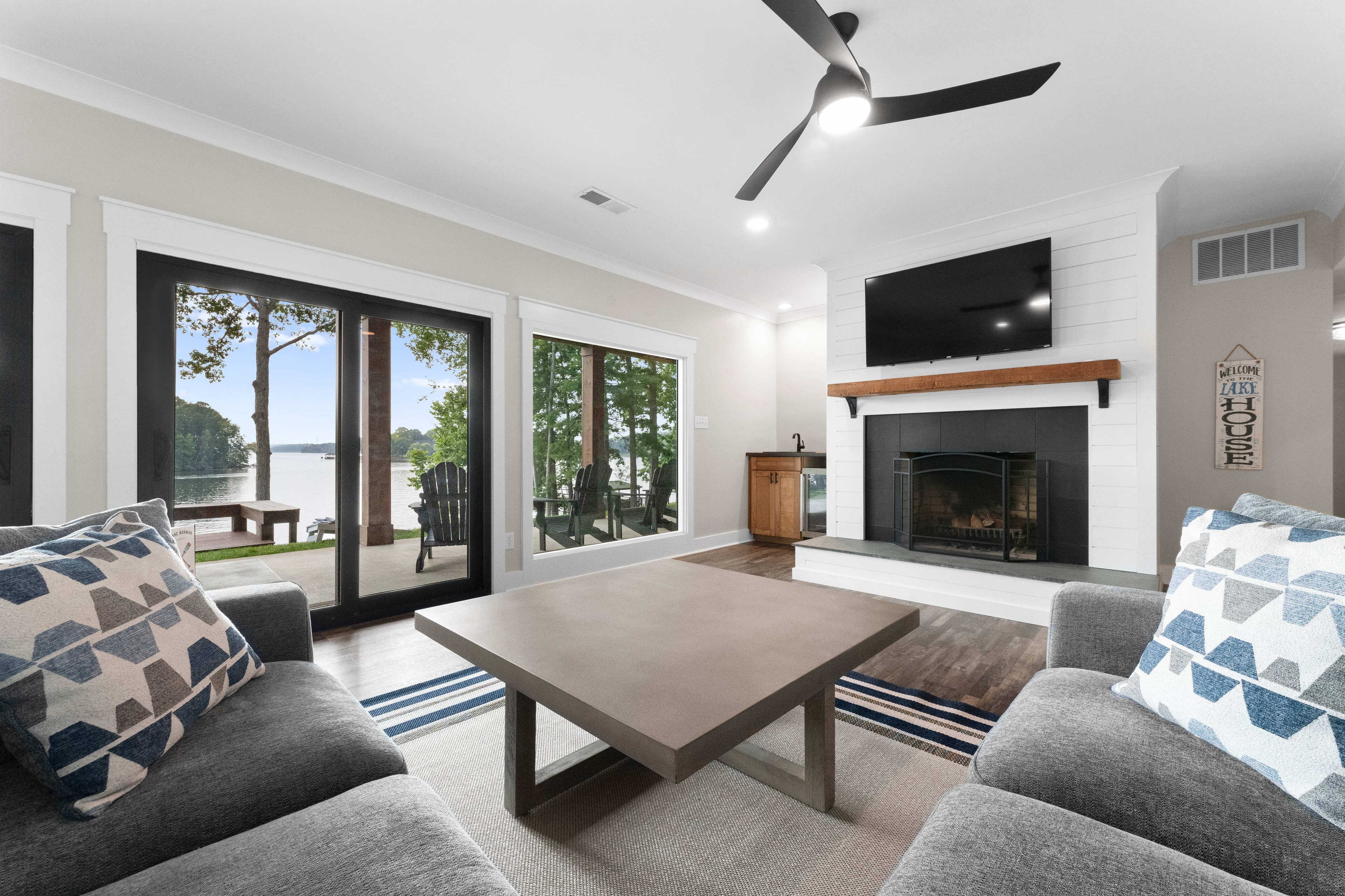 Family room with large sectional, pool table, TV & wet bar. 