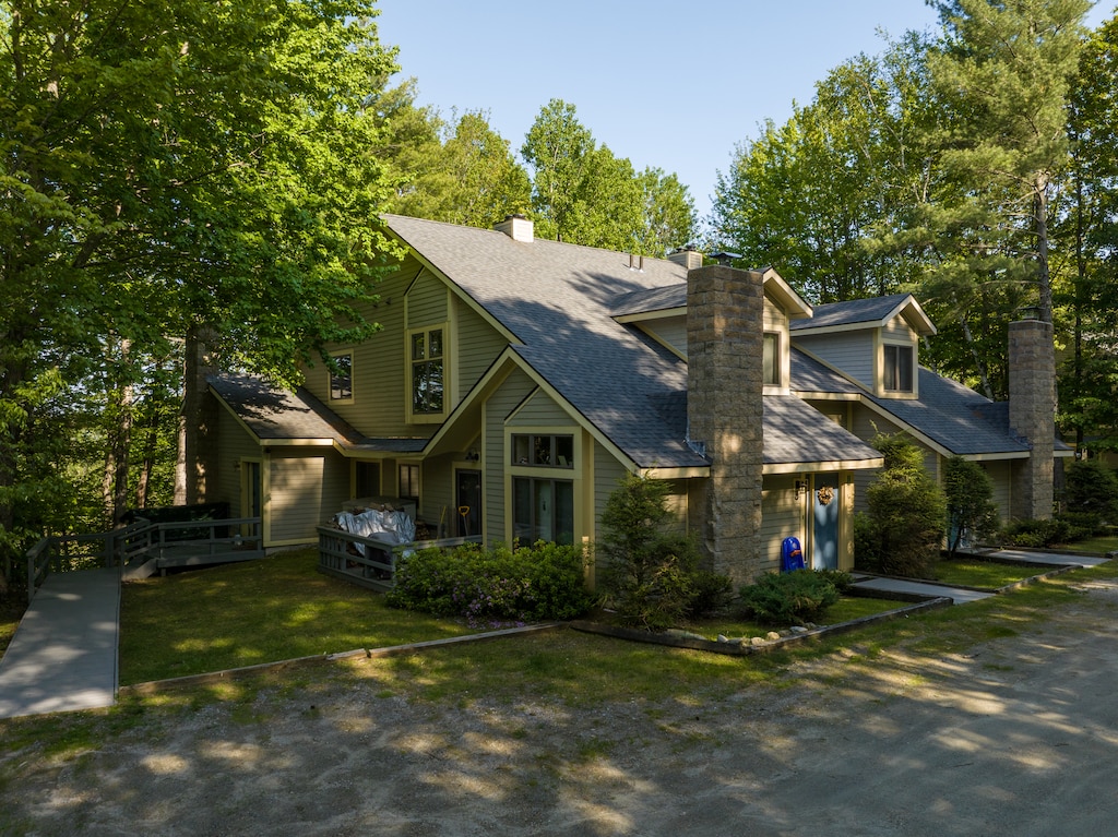 - Spacious vacation rental surrounded by trees near Okemo Mountain - Charming home with fireplace outdoor deck and private hot tub - Perfect base for skiing hiking and exploring nearby attractions