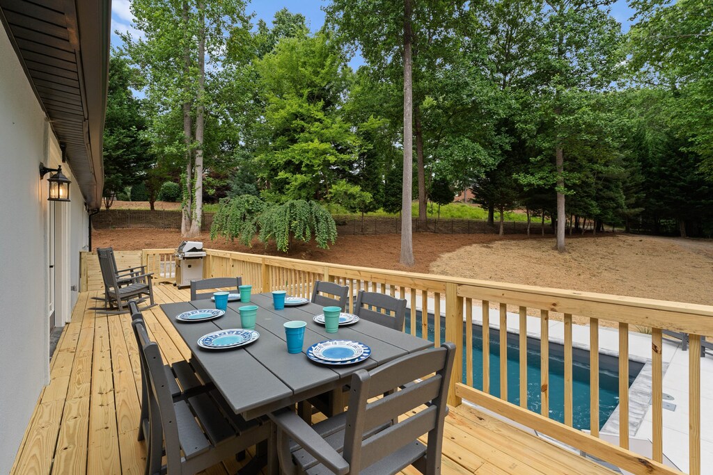 Back deck with table seating for 6 along with 2 rockers & a grill, propane provided. 