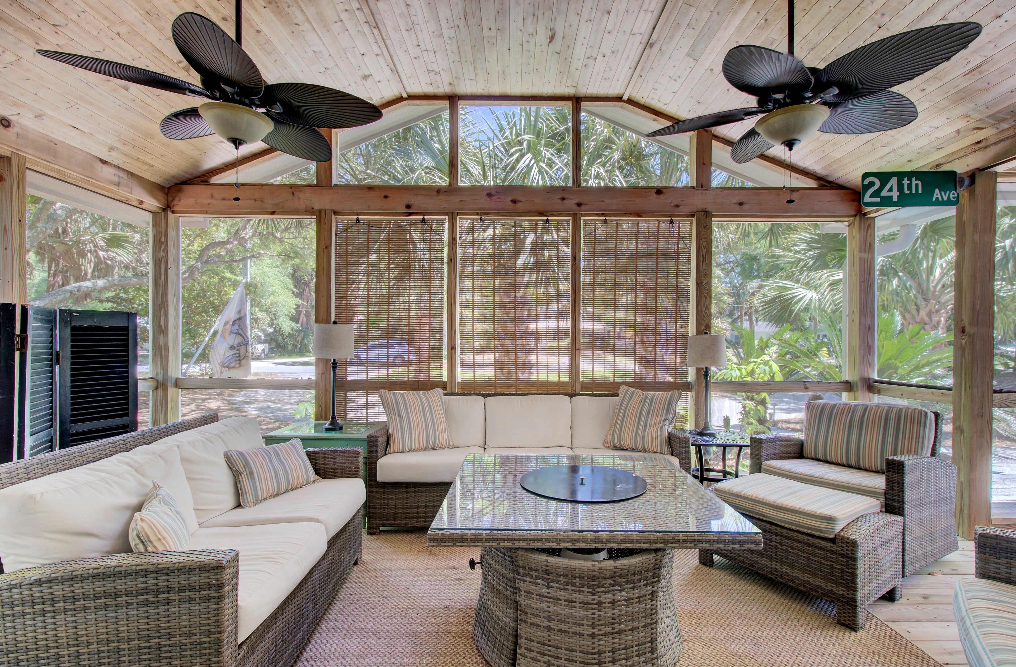 Outdoor, screened-in living space on the porch.