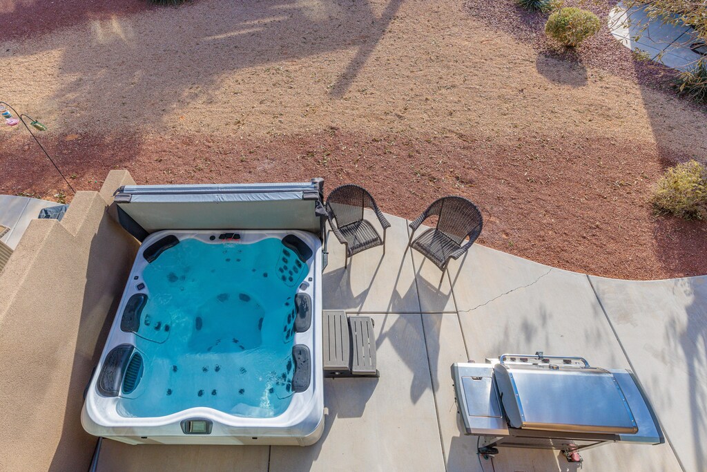 From the private balcony you can overlook the hot tub and surrounding landscapes.