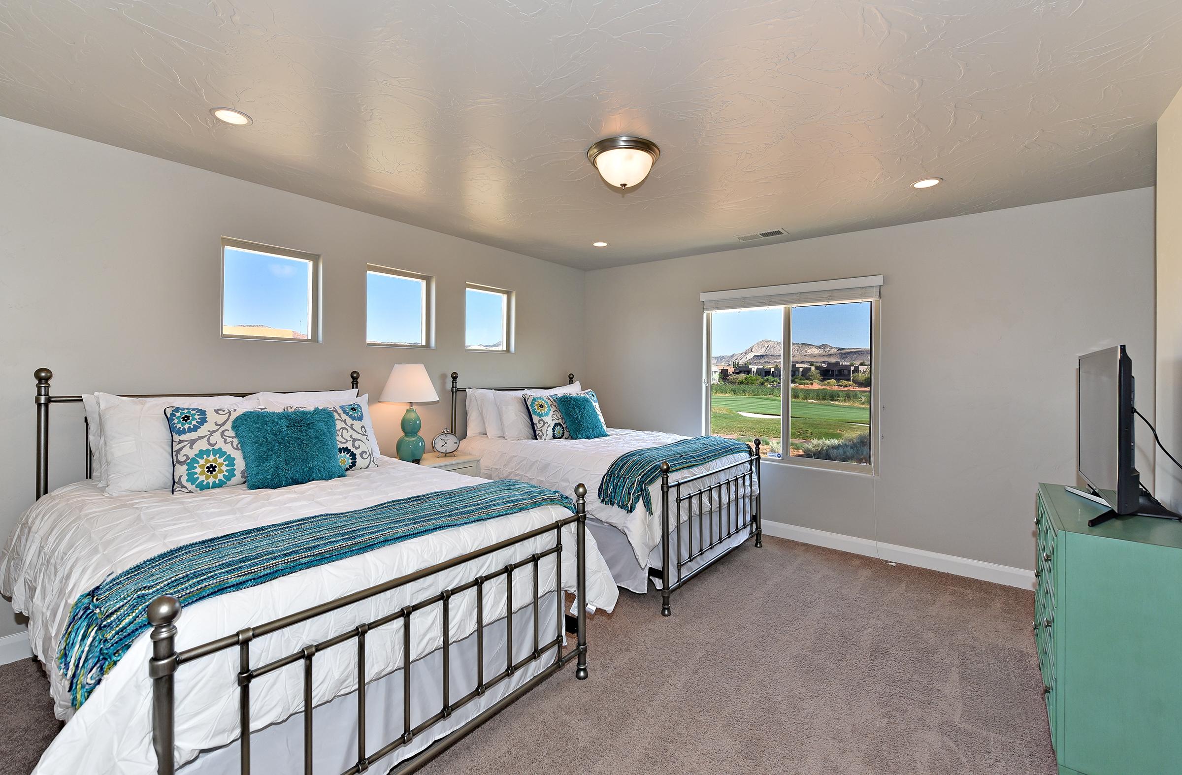 Bedroom 4 is a large bedroom which includes two queen beds, walk-in closet and private satellite TV.