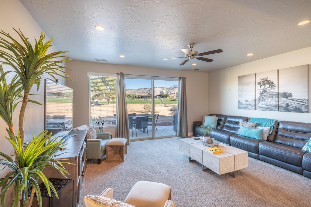 The living room is conveniently adjacent to the kitchen. There is also access to the back patio which has a BBQ grille suitable for all your favorite BBQ dishes.
