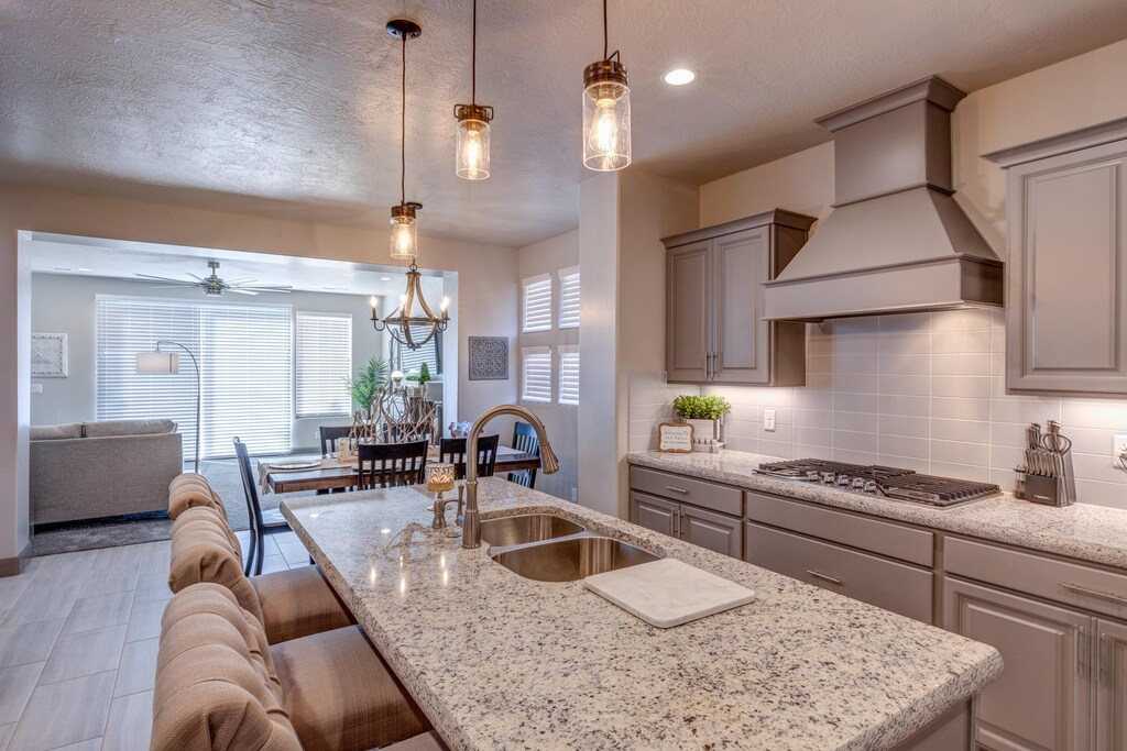 The Kitchen is complete with everything you will need for meal preparations including pots, pans, baking dishes, plates, cups, silverware, cutlery, and an assortment of cooking utensils.