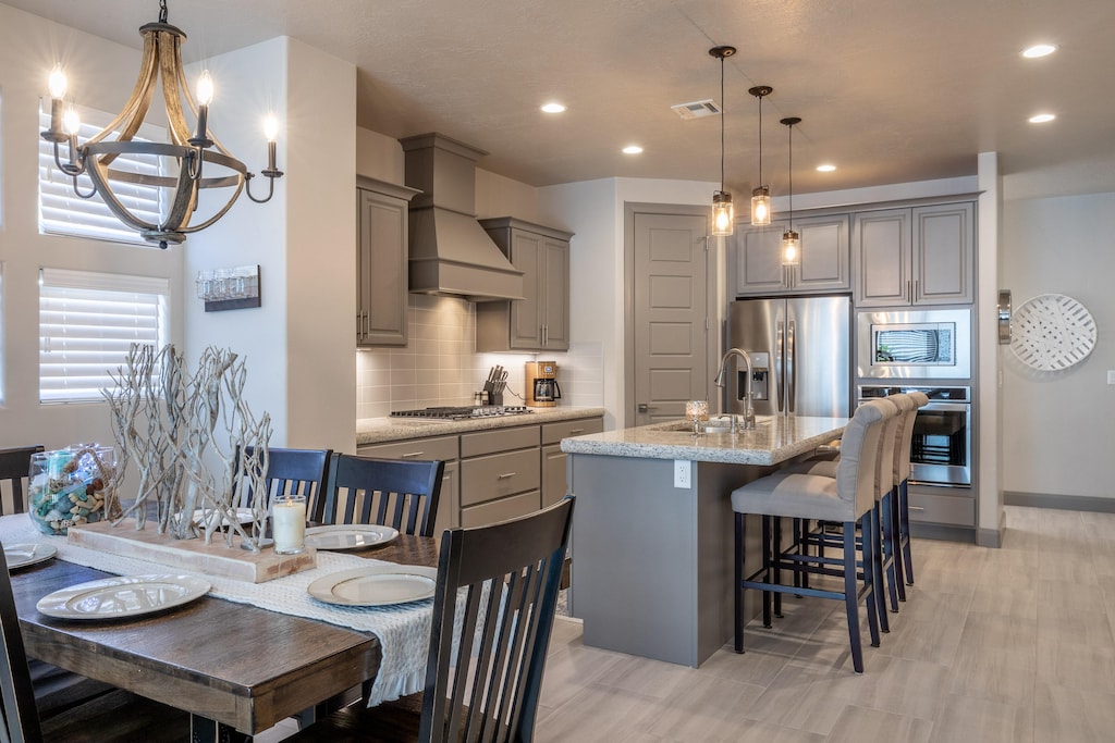With an open and spacious floor plan, the Dining Room and Kitchen can accommodate meal preparations for groups large or small. 