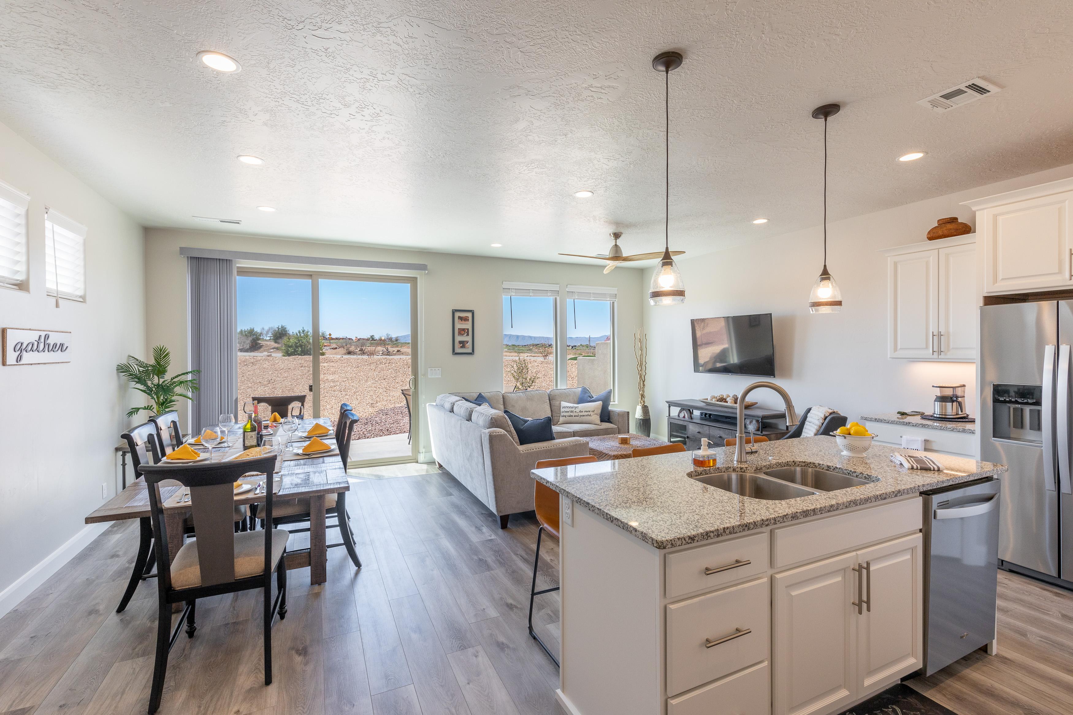 The living room is conveniently adjacent to the kitchen. There is also access to the back patio which has a BBQ grille suitable for all your favorite BBQ dishes.