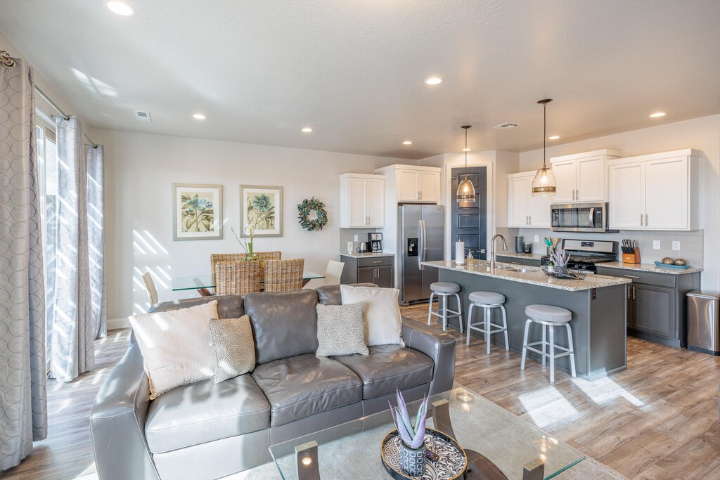 The Living Room is located adjacent to the dining room and is the perfect place to relax and watch your favorite movie or TV program.