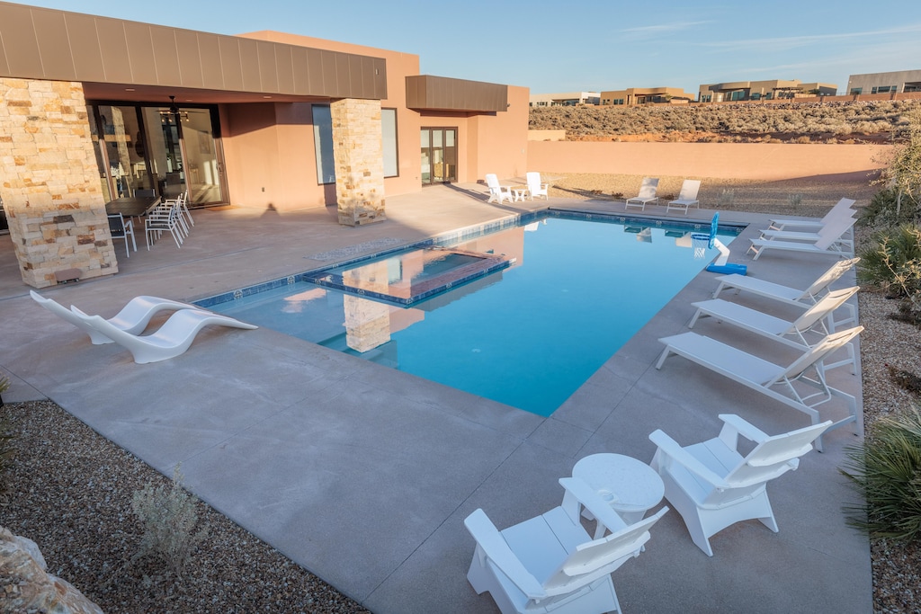 Right outside the sliding door from the dining room, you will find this beautiful, private pool and hot tub, heated year-round.