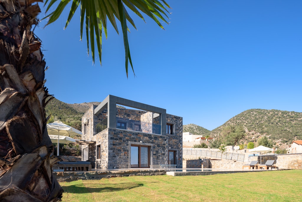 A modern Cretan hideaway complete with beautiful gardens.  
