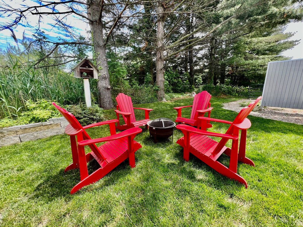 Cozy up in the evenings by the backyard fire pit.