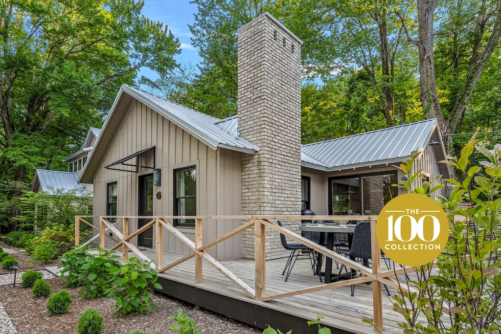 This charming cabin with a cozy deck and inviting patio is the perfect spot to unwind and soak in nature's beauty.