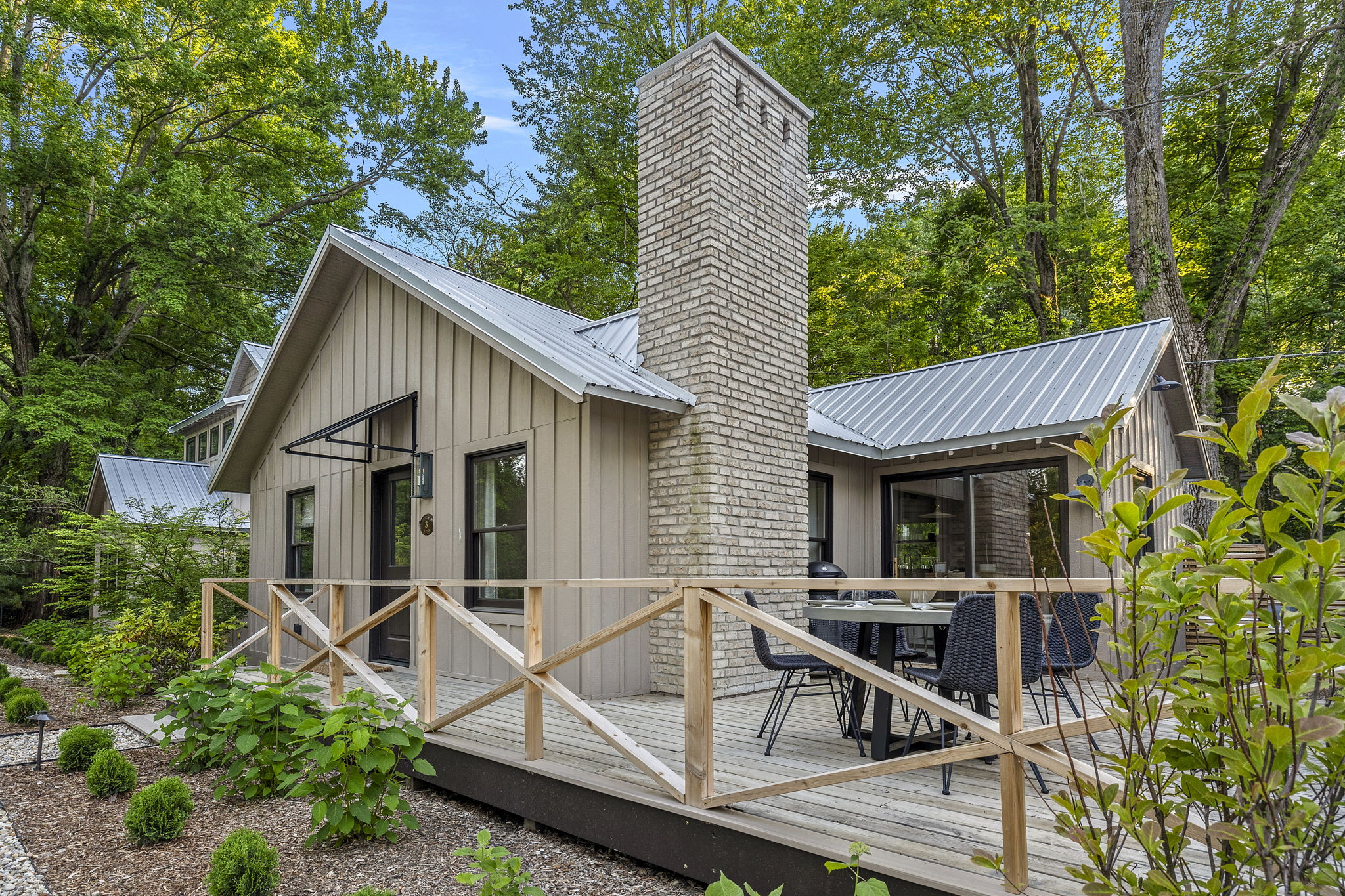 This charming cabin with a cozy deck and inviting patio is the perfect spot to unwind and soak in nature's beauty.