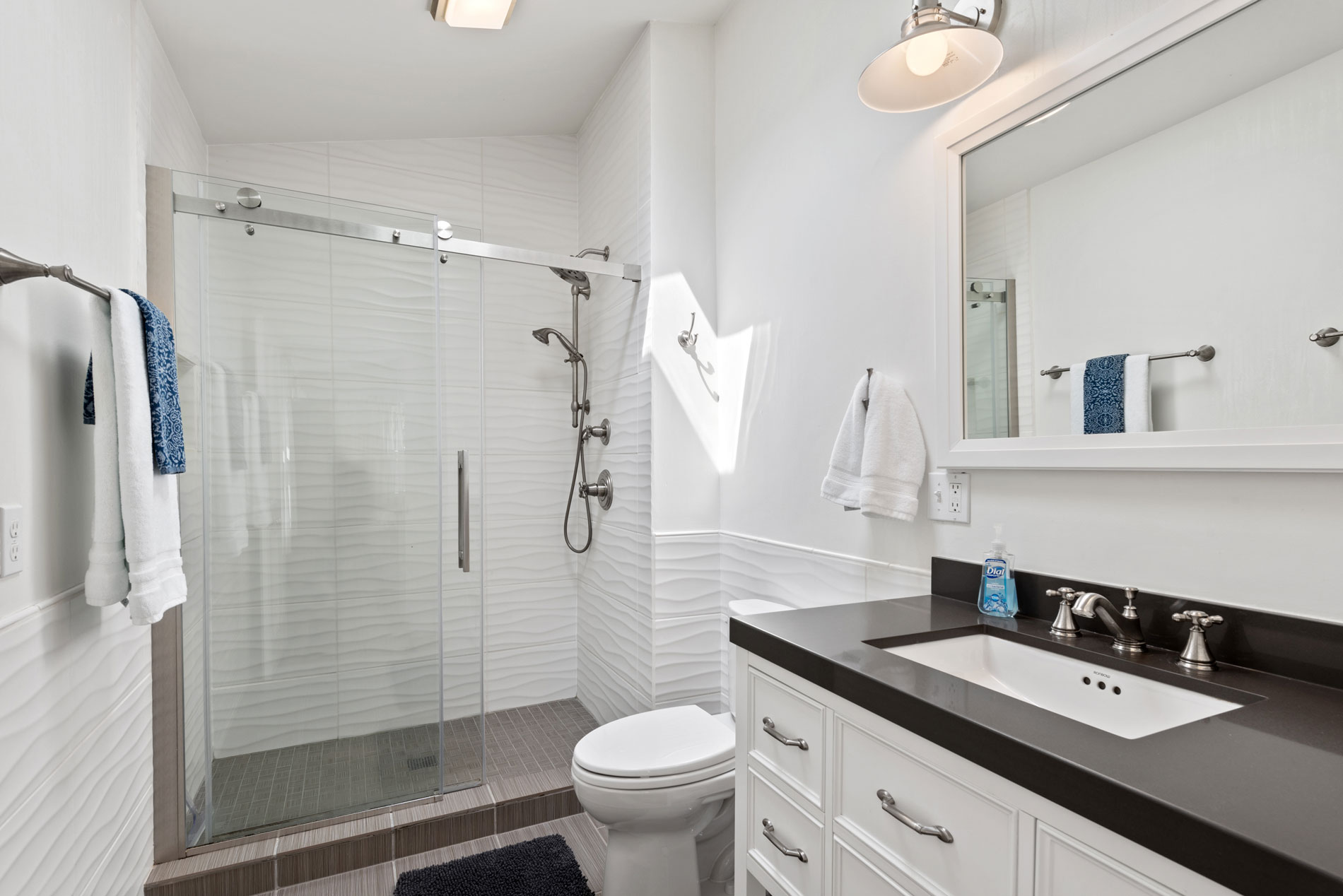 Enjoy a spa-like experience in this stunning, modern bathroom.