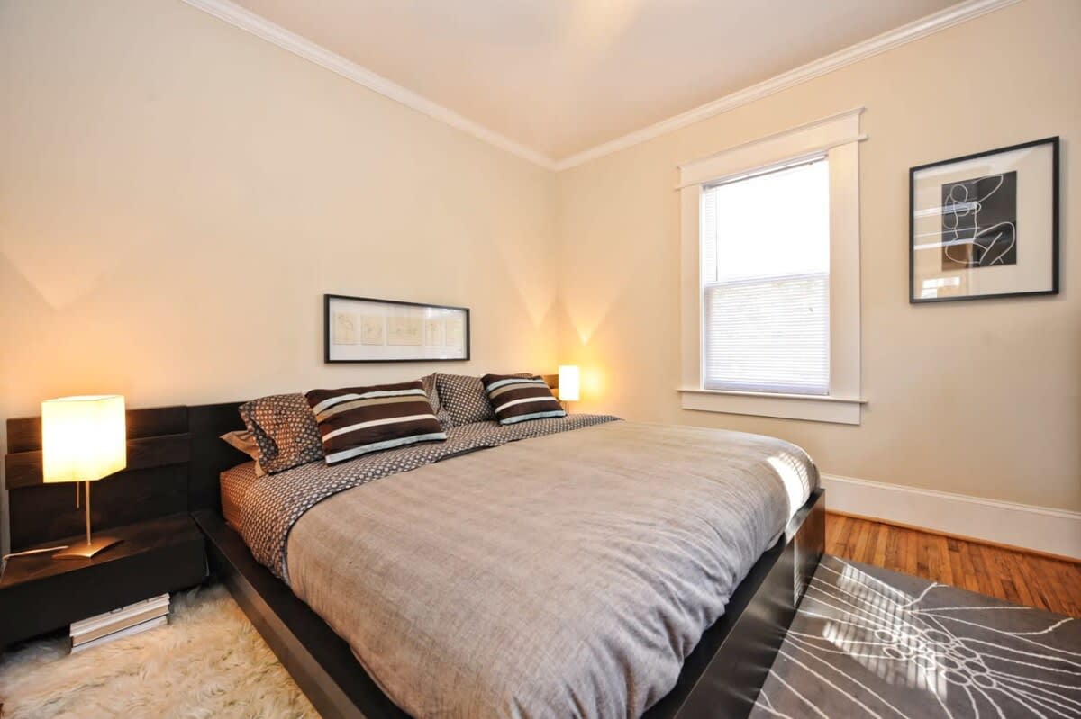 Minimalist bedroom with bedside lamps