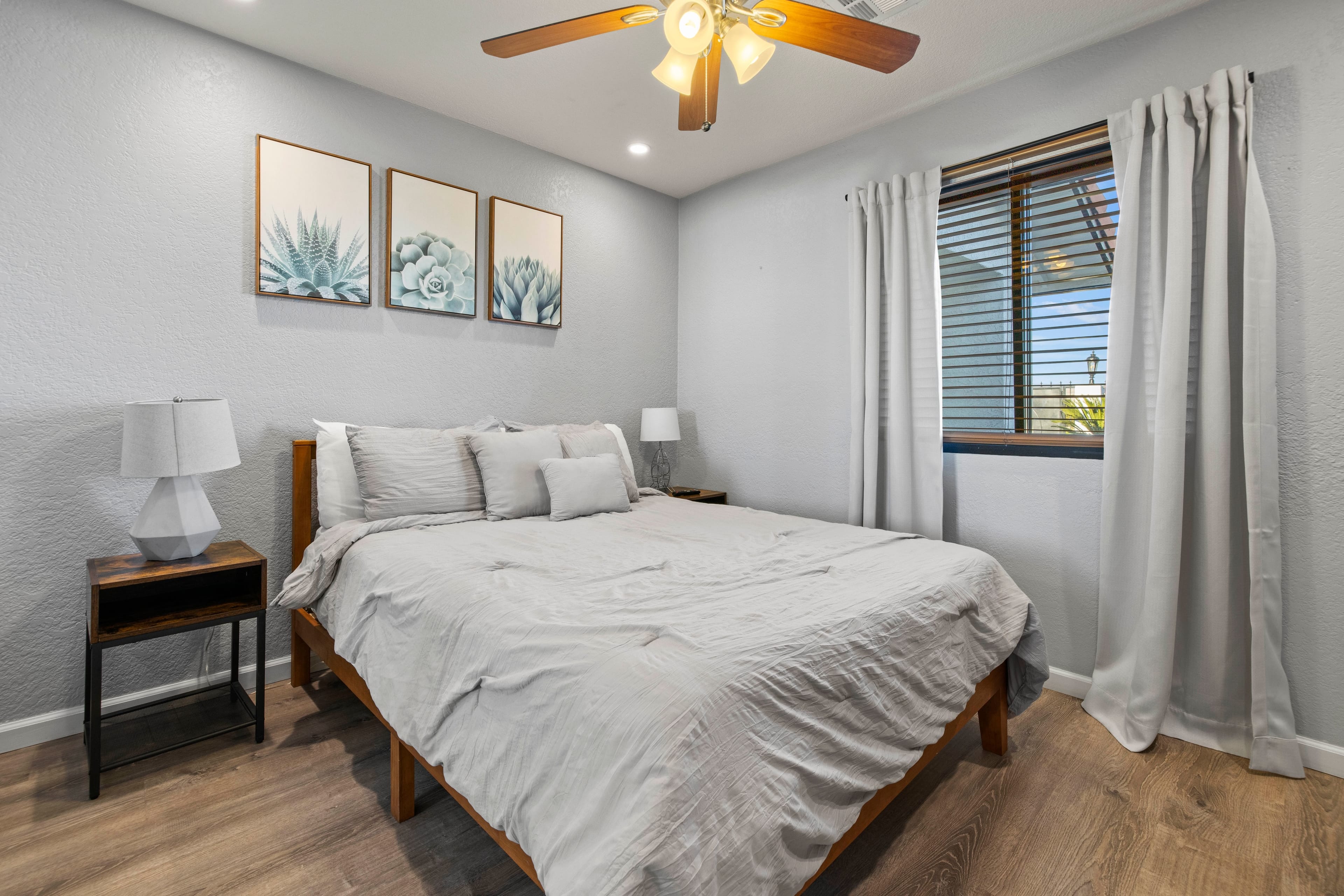 Bedroom 3 features a queen bed and a TV.