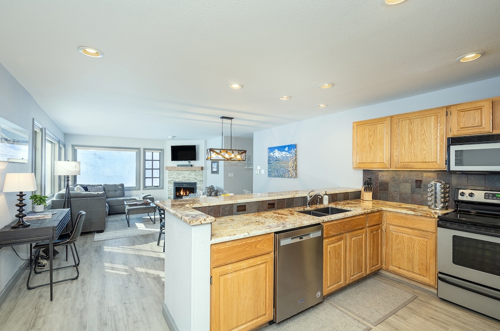 Open Concept condo with stunning views, fireplace, and shared hot tub.