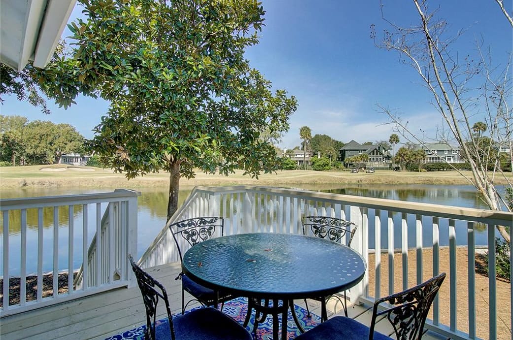 Outdoor dining with golf and lagoon views.