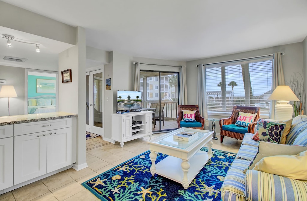 Spacious living room with deck access.