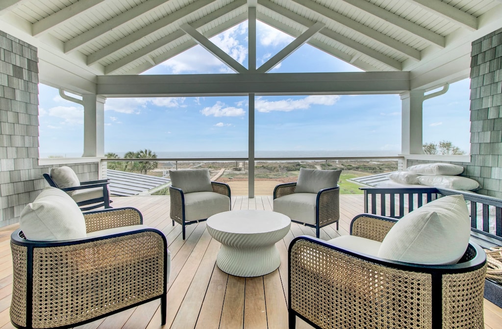 Covered patio with amazing ocean view and comfortable seating.