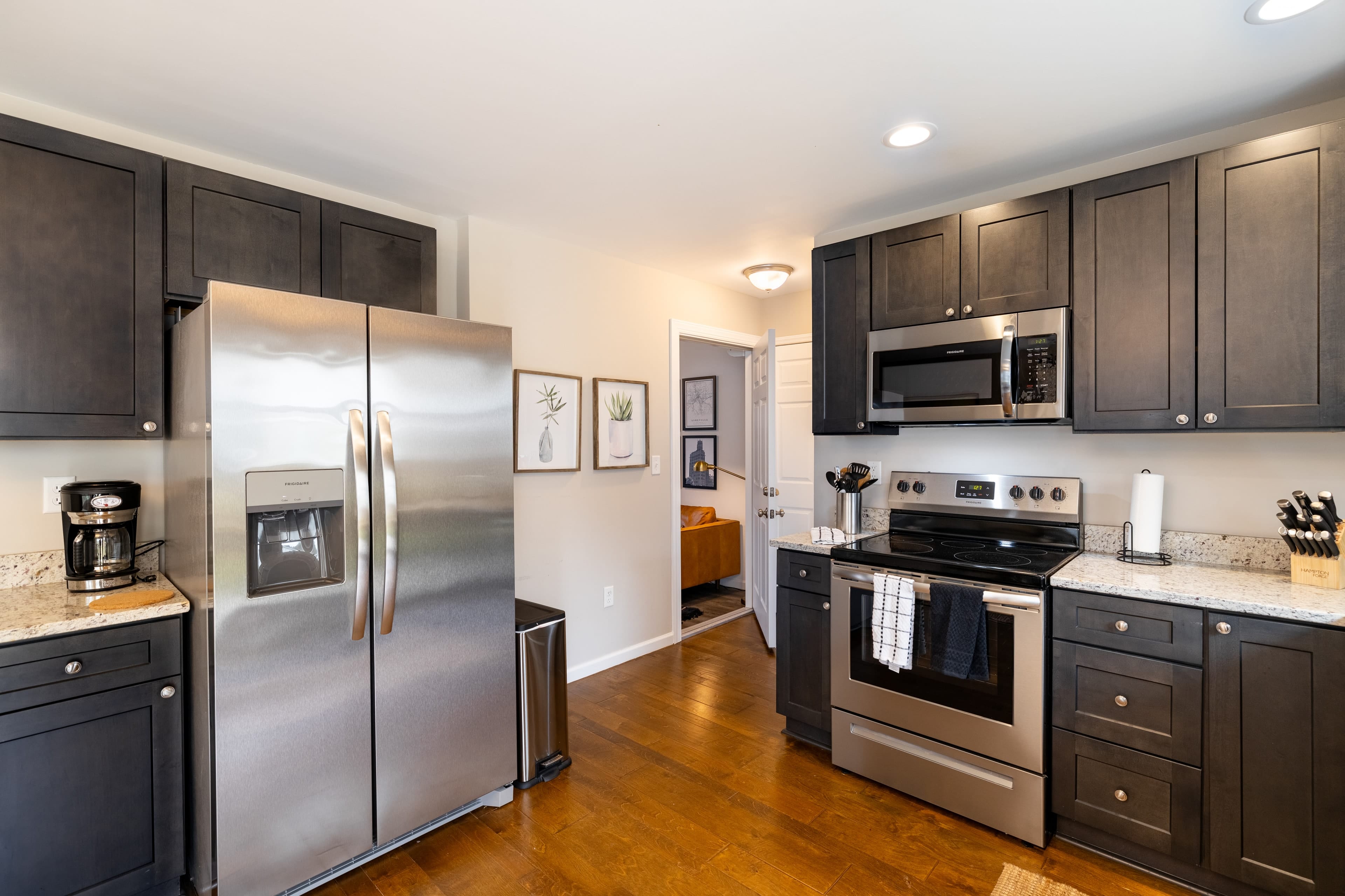 Kitchen is fully equipped and features stainless steel appliances.