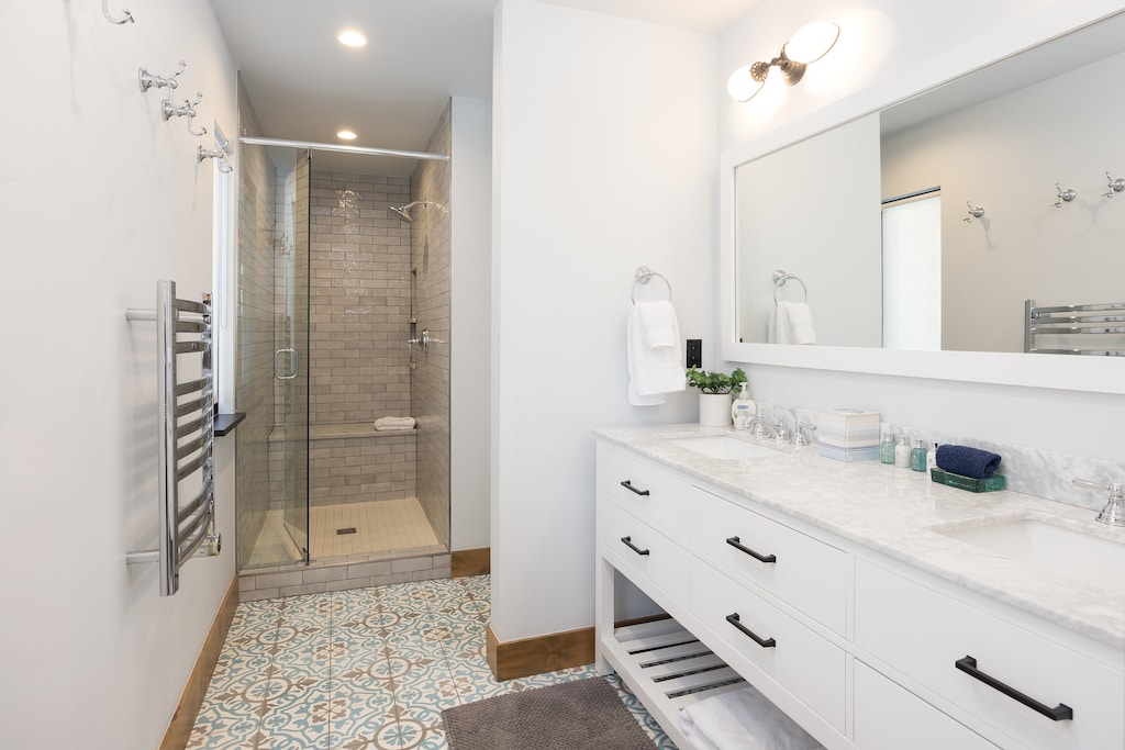 walk-in shower, two vanities built-in towel warmer