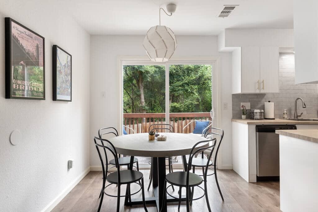 Dining area with access to deck and backyard