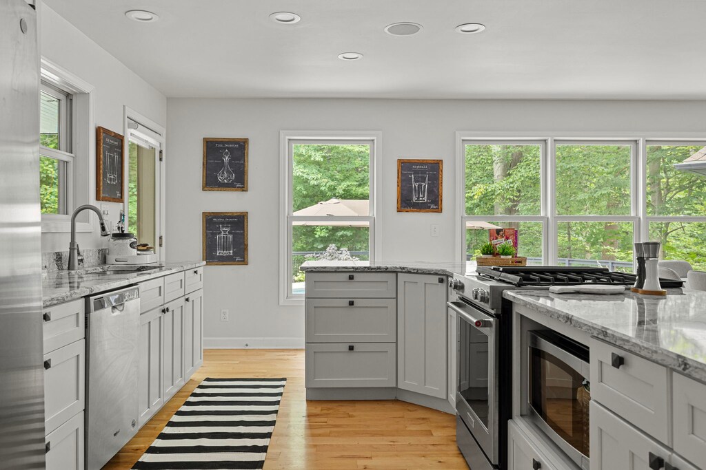 Cook up culinary delights in this bright, modern kitchen with a view.