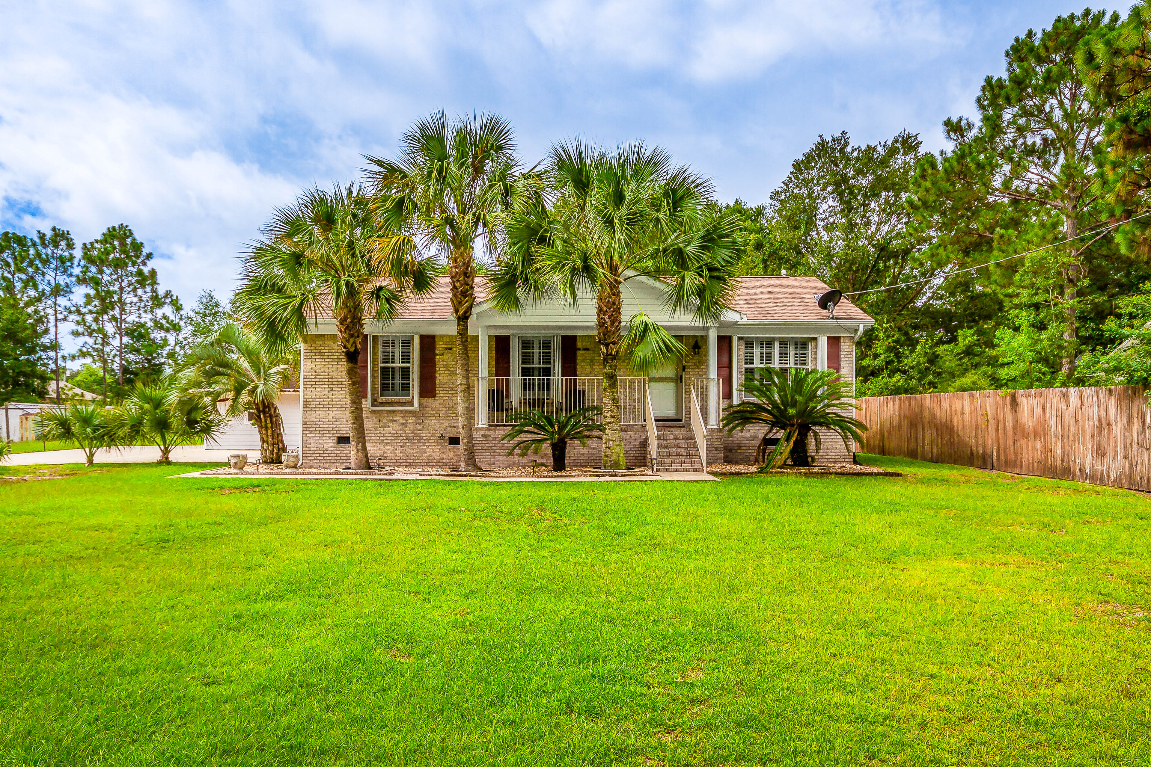 Property Image 1 - Navarre Home w/ Palm Tree Views ~ 4 Mi to Beach!