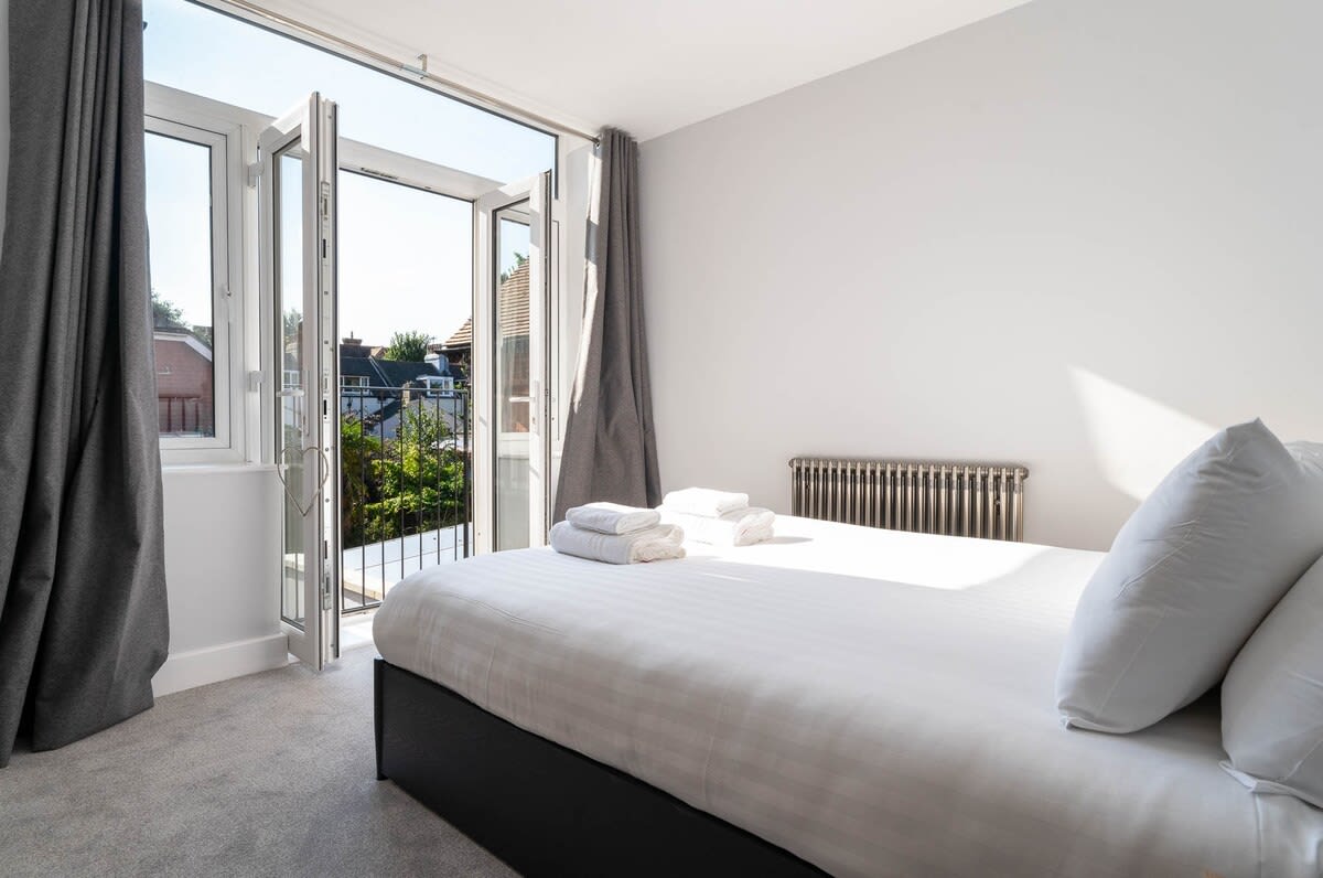 Master bedroom - light and bright with king size bed and Juliette balcony. Plenty of fresh bed linen and towels are provided.