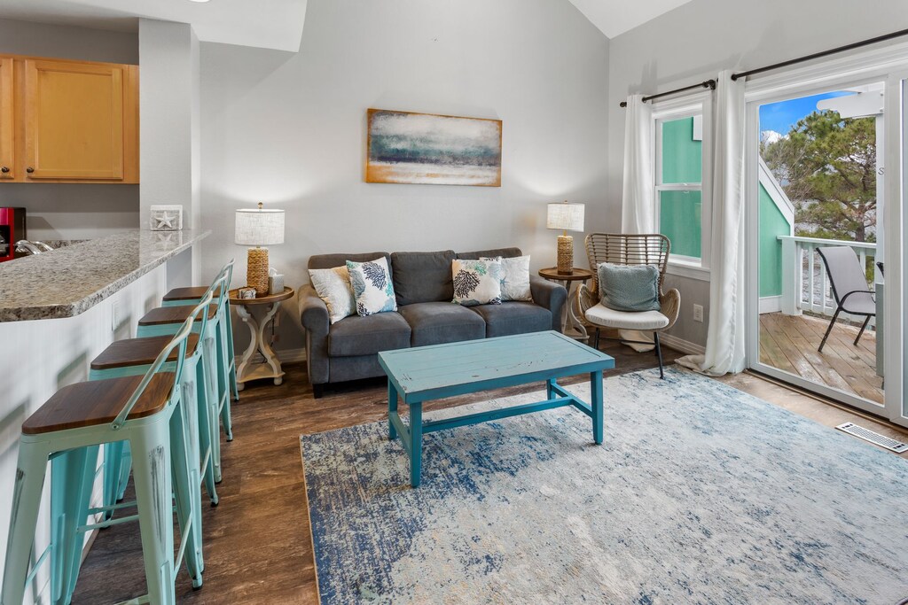 The spacious Living Area with the adjacent Kitchen is great for relaxing after a long day at the beach!