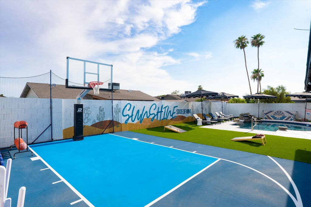 Embrace our backyard paradise with a basketball court, cornhole, private pool, loungers, and more outdoor fun!